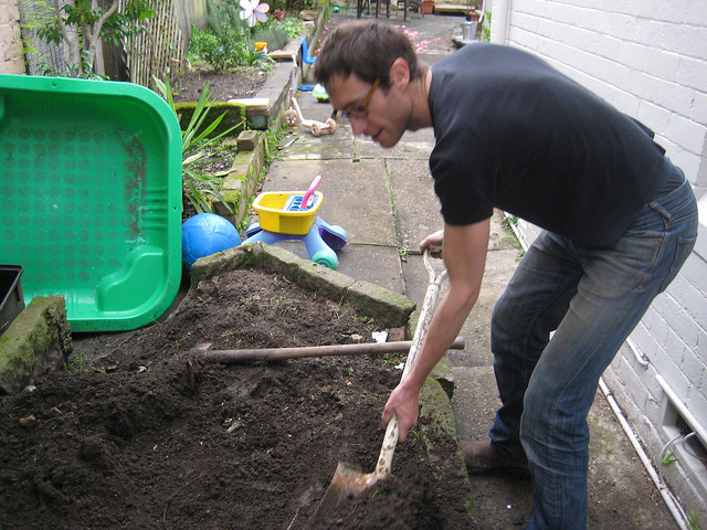 Lucas collects dirt from neighbouring resident, August 2010.